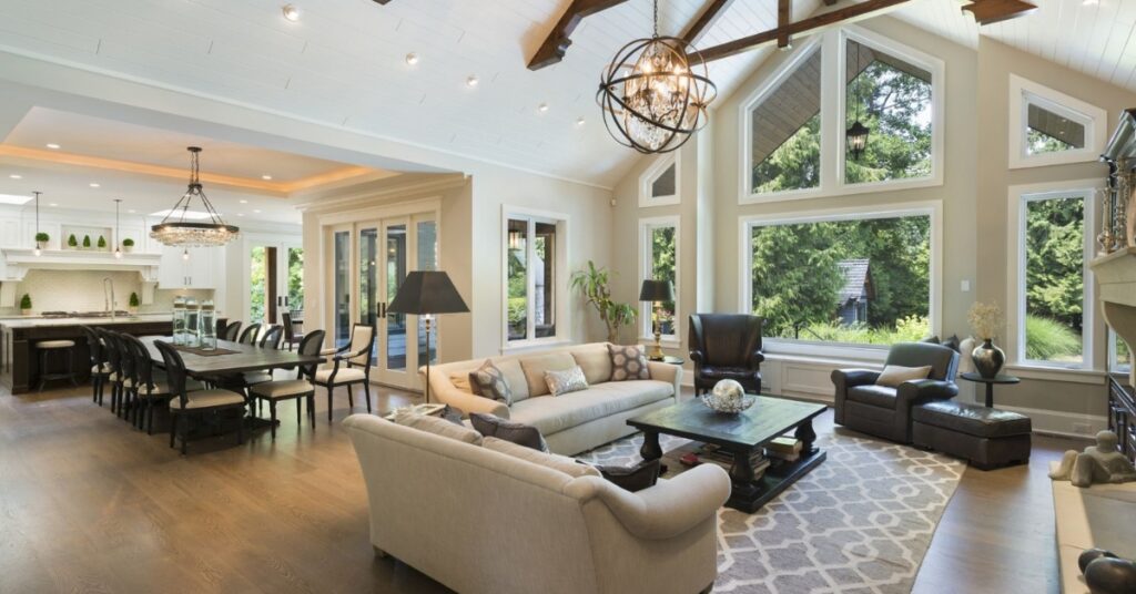 Modern luxury home interior with open-plan spatial planning, natural light, sculptural staircase, and refined contemporary materials