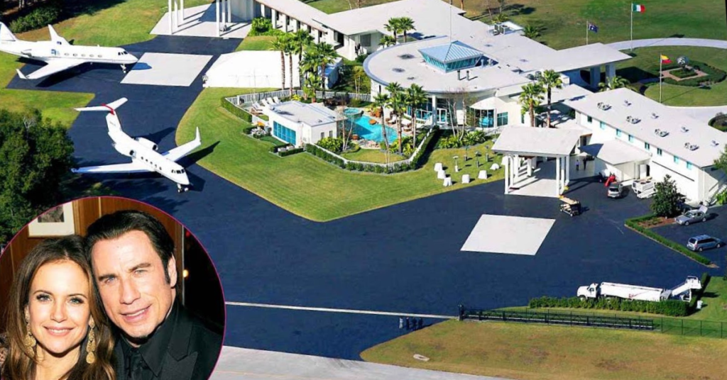 Aerial view of John Travolta house at Jumbolair Aviation Estates featuring private runway and airplane hangar in Florida